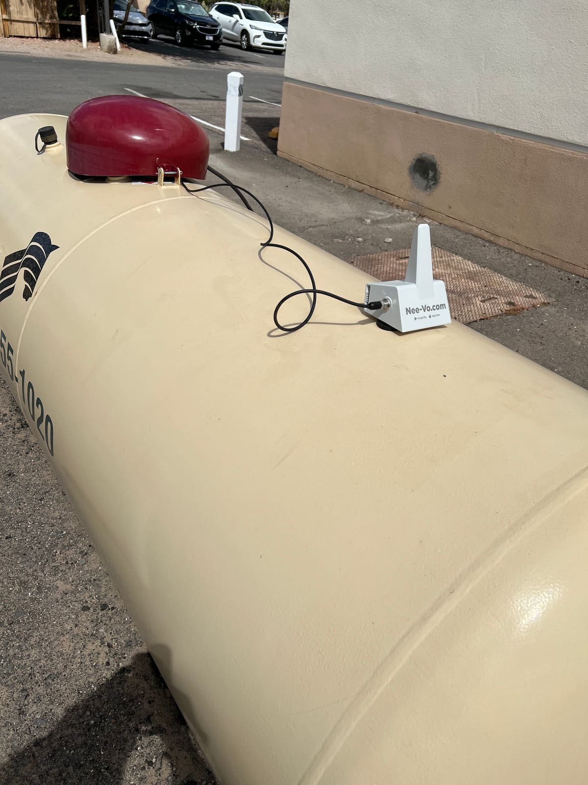 A remote tank-level monitor mounted on a propane tank for automatic keep-full delivery.