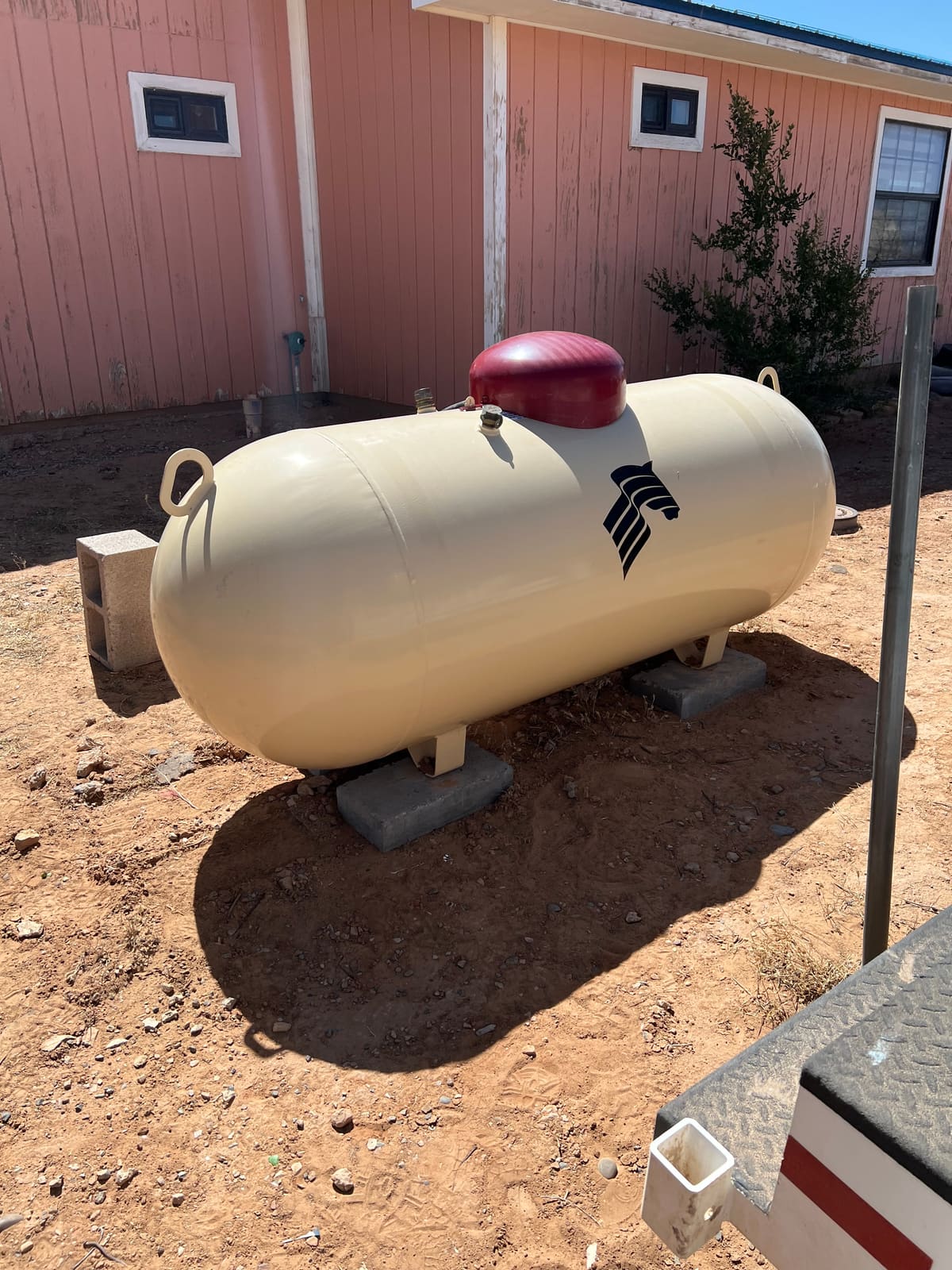 A propane tank installed at a home in the Four Corners region by Running Horse Services.